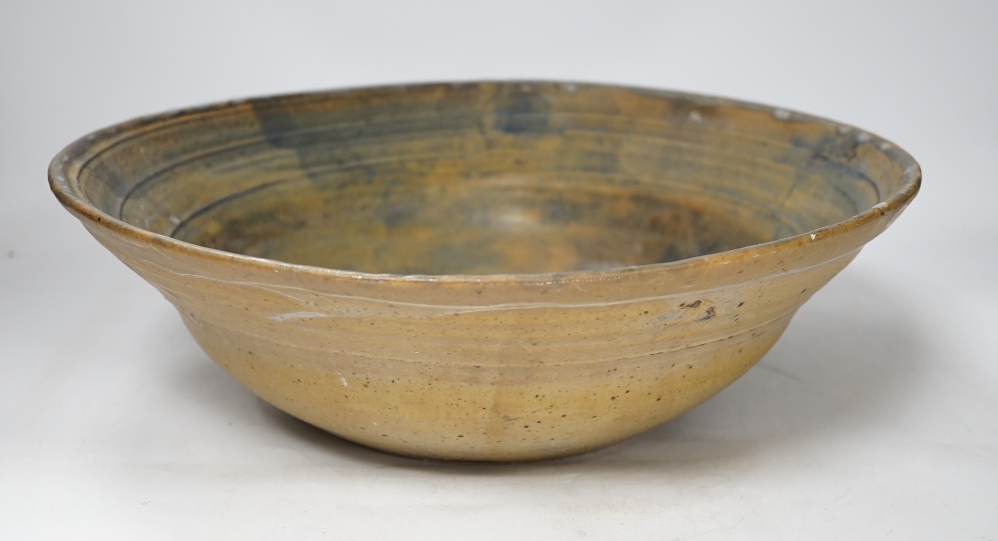 A large studio stoneware centre bowl with ‘B’ makers mark, 38cm in diameter. Condition - good